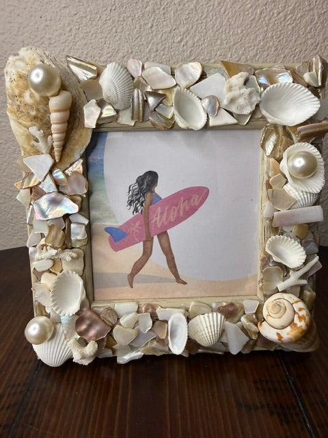 Handmade white seashell and pearl picture frame with Aloha surfer art inside